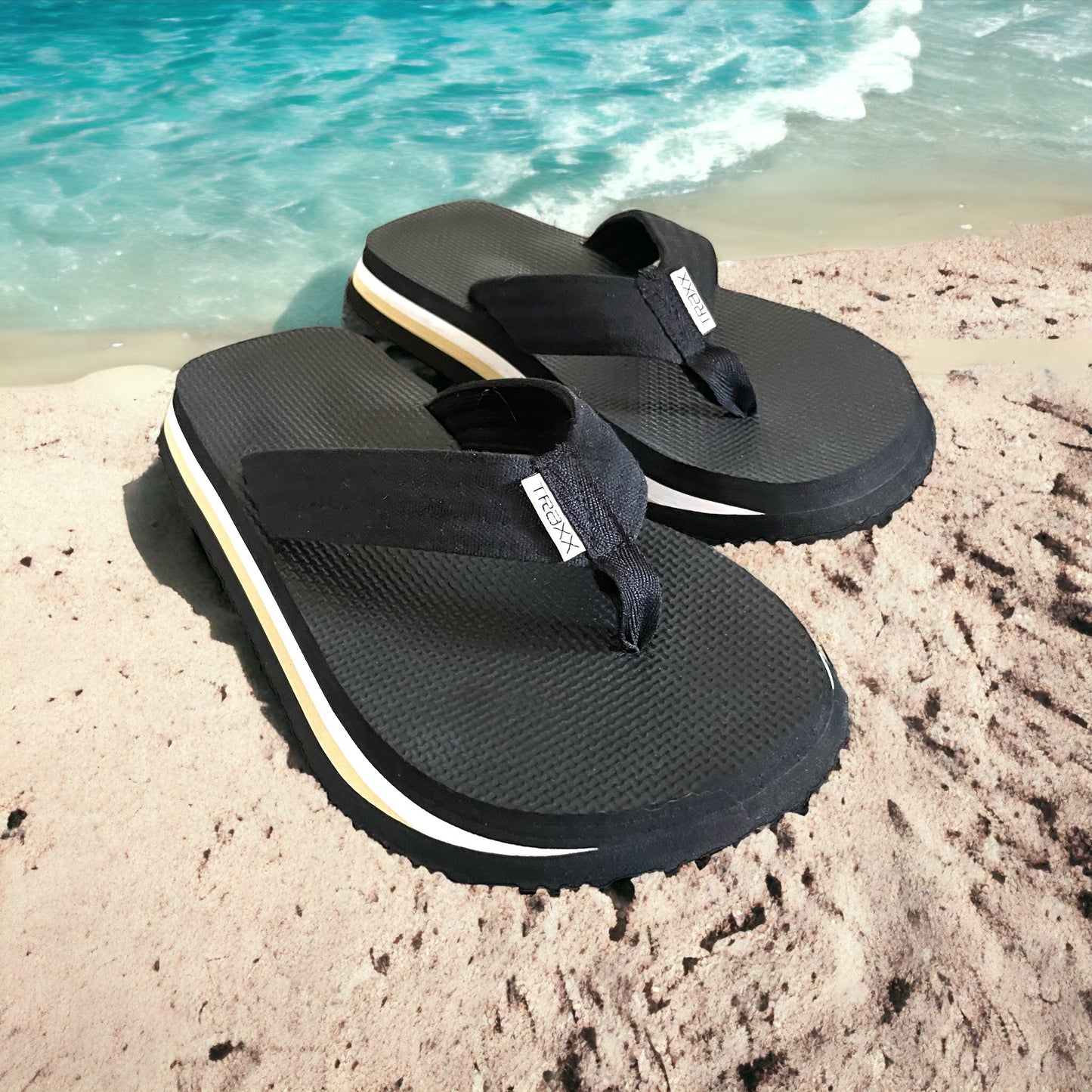 Thongs with an extra wide sole and a lined toe strap for comfort. Modern Black, White and Beige colours